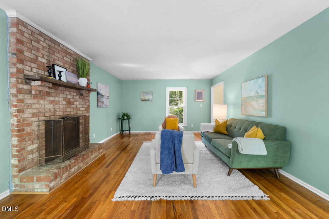 122 Stedwick Place Durham, NC 27712 - Photo 10 of 39 a living room with furniture and a fireplace
