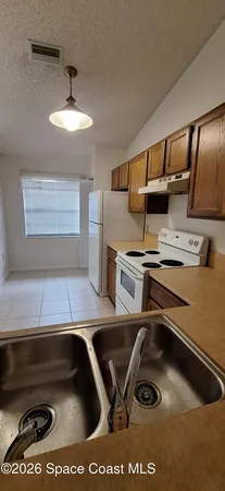 a room with gym equipment and a stove