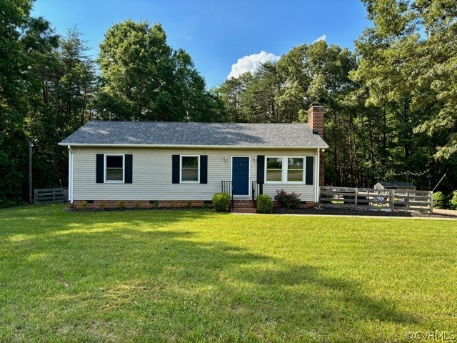 1217 Windyknight Road Montpelier, VA 23192 - Photo 1 of 11 a front view of a house with a garden