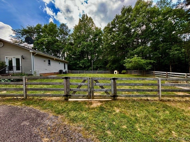 1217 Windyknight Road Montpelier, VA 23192 - Photo 4 of 11 a view of a yard with wooden fence