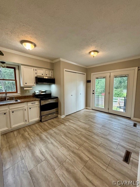 1217 Windyknight Road Montpelier, VA 23192 - Photo 6 of 11 a kitchen with stainless steel appliances a stove top oven and a refrigerator
