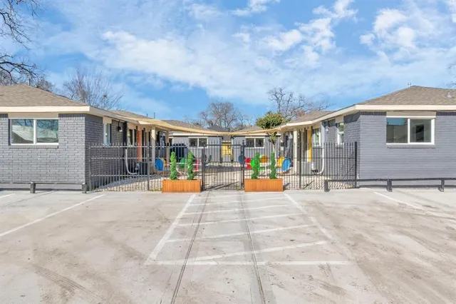 a view of a house with sitting area and garden
