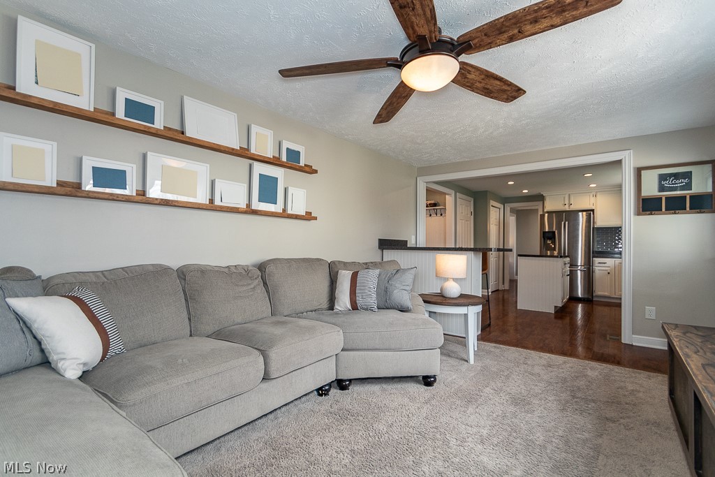 3080 Gale Road Willoughby, OH 44094 - Photo 15 of 45 Living room featuring ceiling fan, a textured ceiling, and dark wood-type flooring