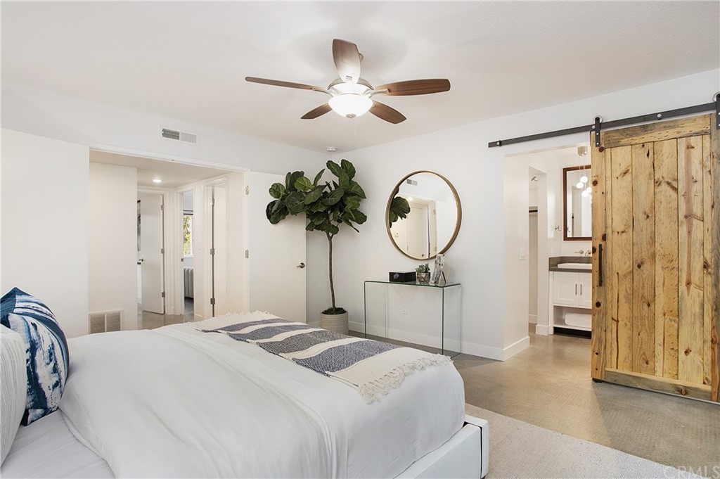 1661 Texas Circle Costa Mesa, CA 92626 - Photo 25 of 36 Barn door leads to en-suite bathroom