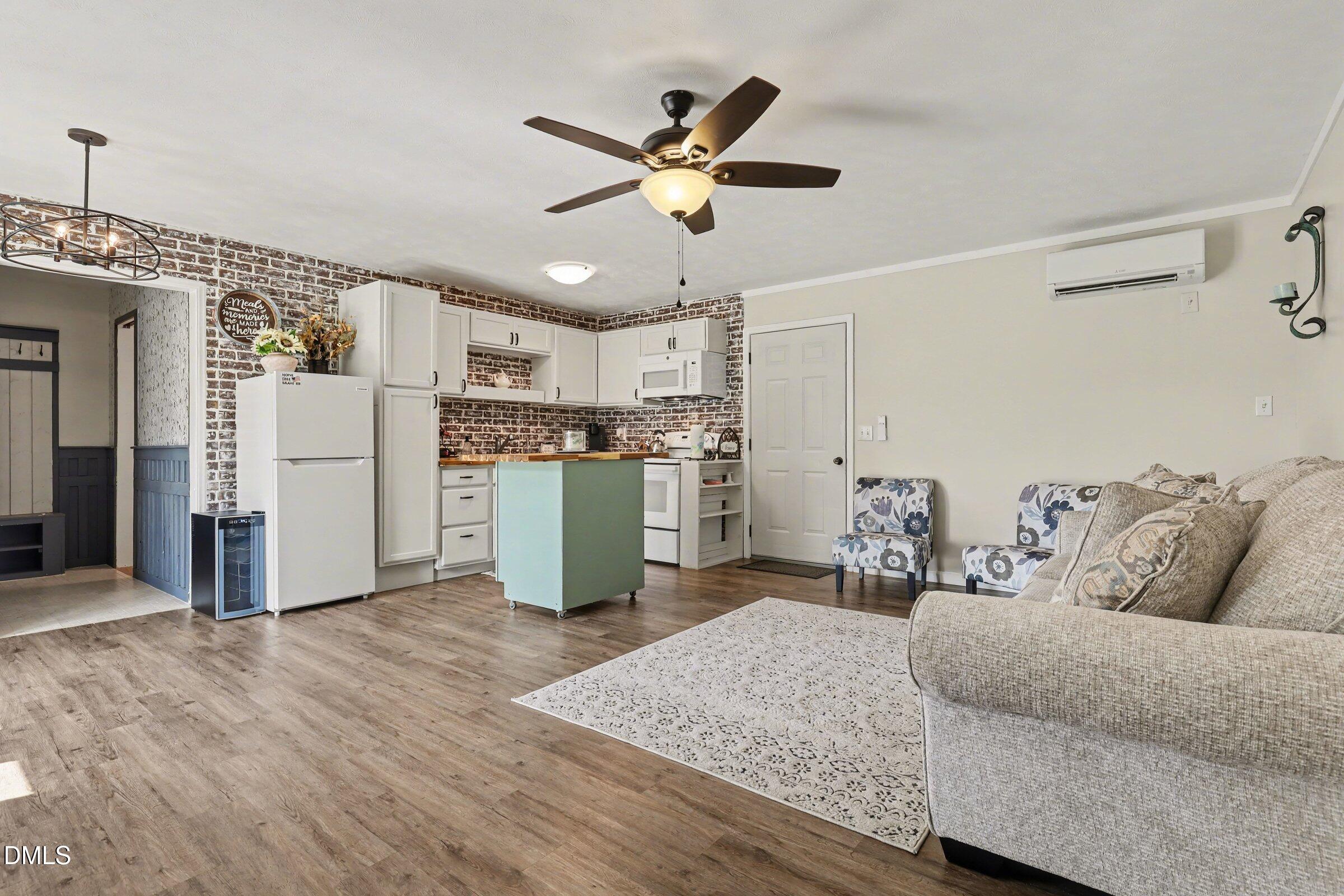 430 Fred Hall Road Stedman, NC 28391 - Photo 55 of 63 a living room with furniture and kitchen view