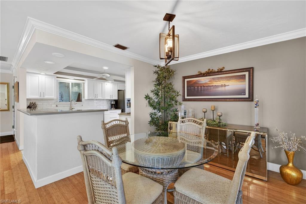 314 Reynolds Court Naples, FL 34112 - Photo 11 of 30 a dining room with furniture and window