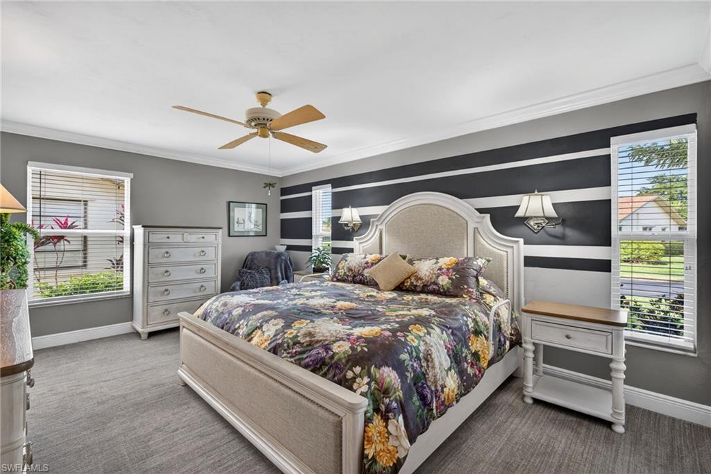 314 Reynolds Court Naples, FL 34112 - Photo 13 of 30 a bedroom with a bed and a ceiling fan