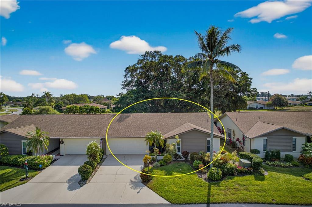 314 Reynolds Court Naples, FL 34112 - Photo 23 of 30 a aerial view of a house with a garden and plants