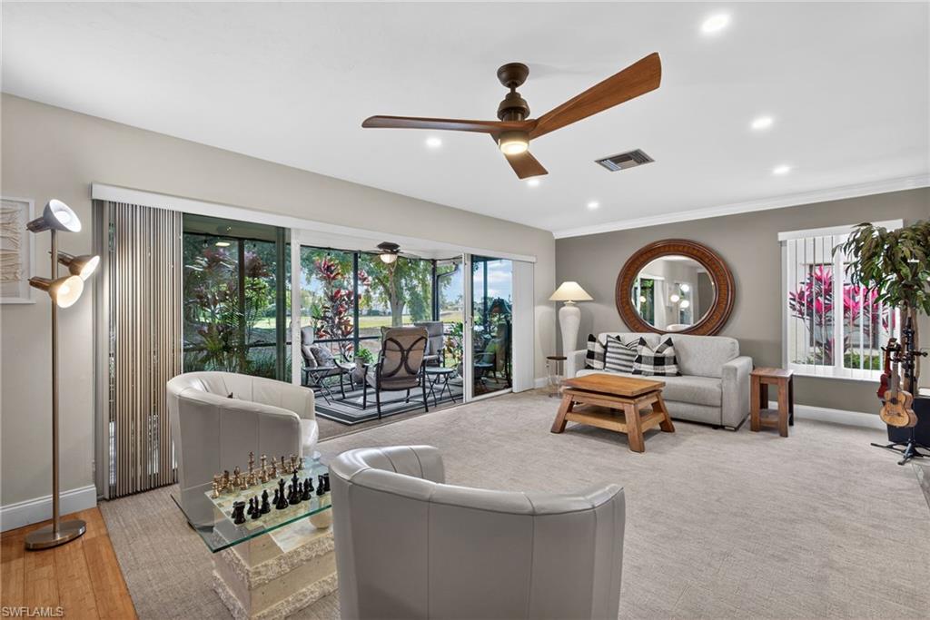 314 Reynolds Court Naples, FL 34112 - Photo 4 of 30 a living room with furniture and a large window with outer view