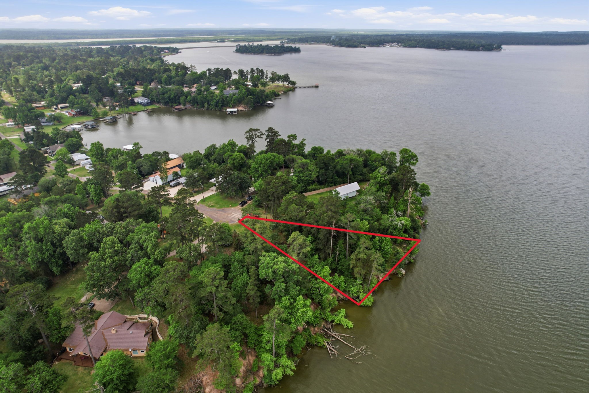 365 North Point Road Trinity, TX 75862 - Photo 3 of 22 Approximately 109 feet waterfront.