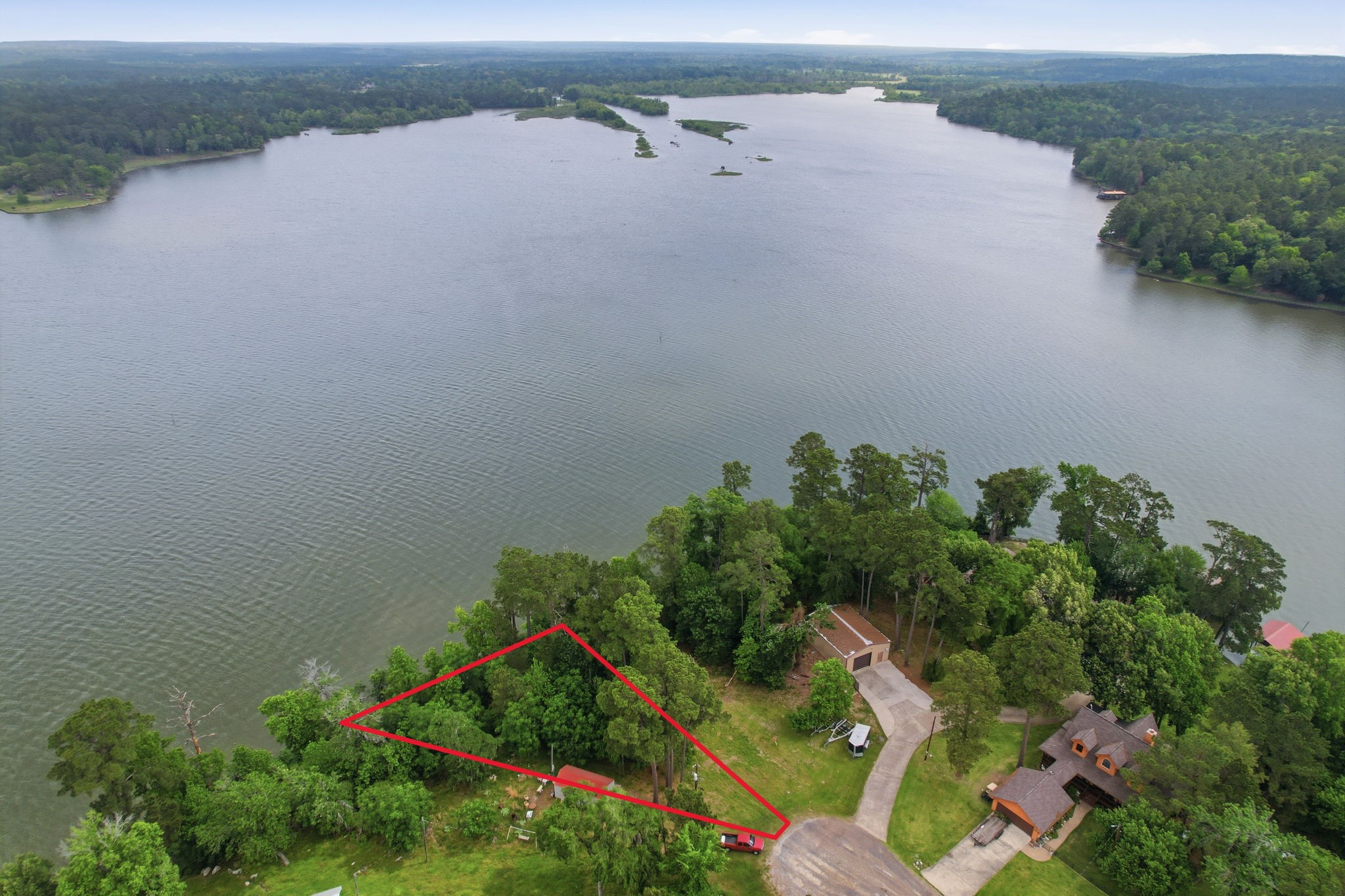 365 North Point Road Trinity, TX 75862 - Photo 7 of 22 Camp Olympia and Whispering Pines Golf Club are located across the lake.