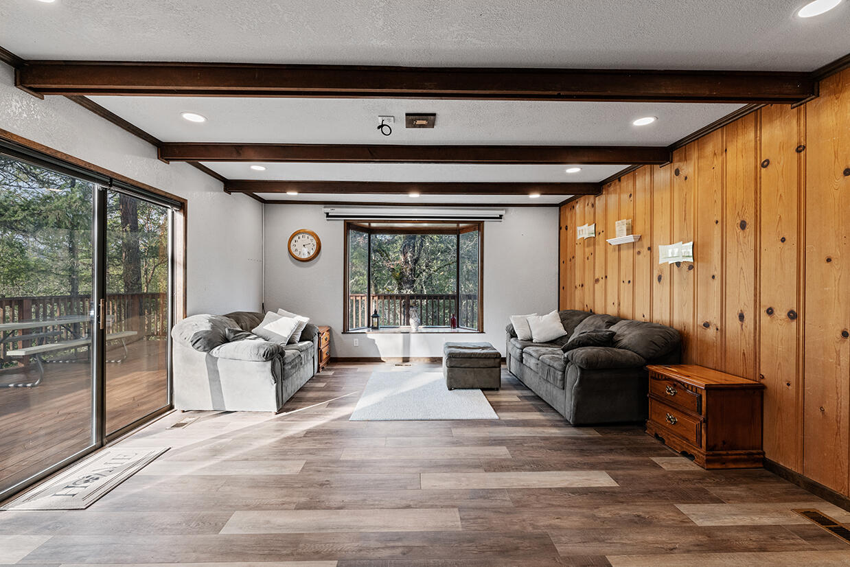 2900 Indian Creek Road Shady Cove, OR 97539 - Photo 10 of 35 a living room with furniture and large windows