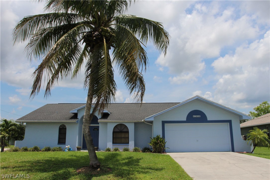 17485 Duquesne Road Fort Myers, FL 33967 - Photo 1 of 25 a front view of house with yard and green space