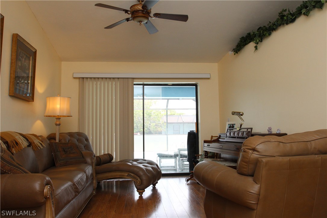 17485 Duquesne Road Fort Myers, FL 33967 - Photo 7 of 25 a living room with furniture and a window