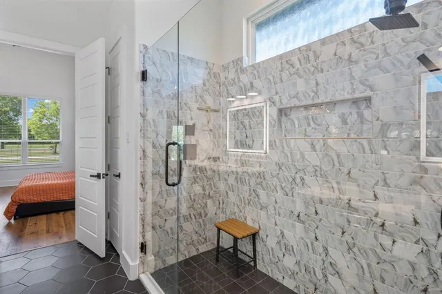 a room with a table chairs and entryway