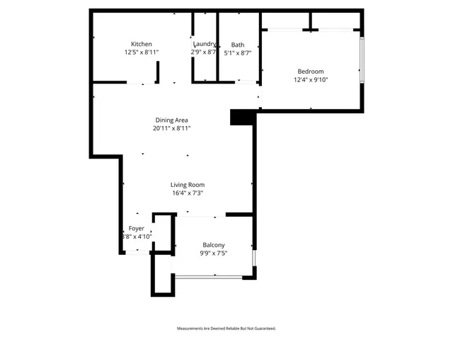 a picture of a bench in front of a wall