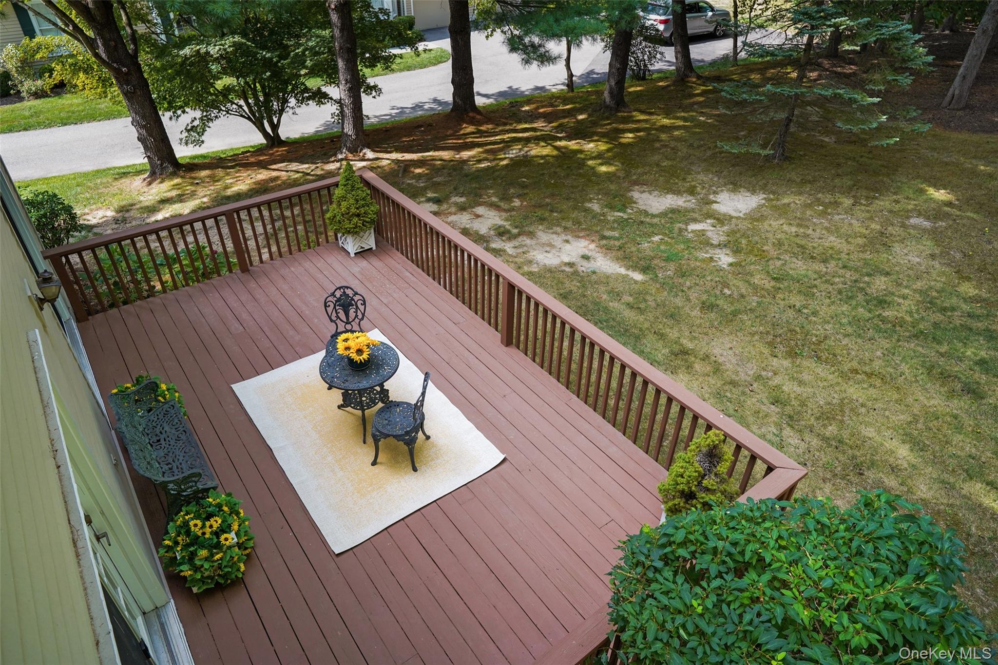 18 Cross River Road Mount Kisco, NY 10549 - Photo 21 of 30 a balcony with wooden floor table and chairs