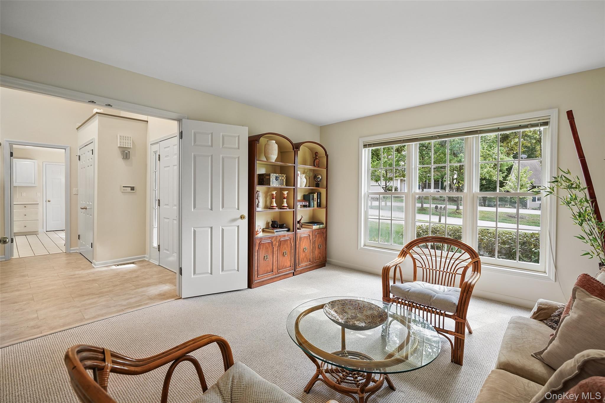 18 Cross River Road Mount Kisco, NY 10549 - Photo 4 of 30 a living room with furniture and a floor to ceiling window