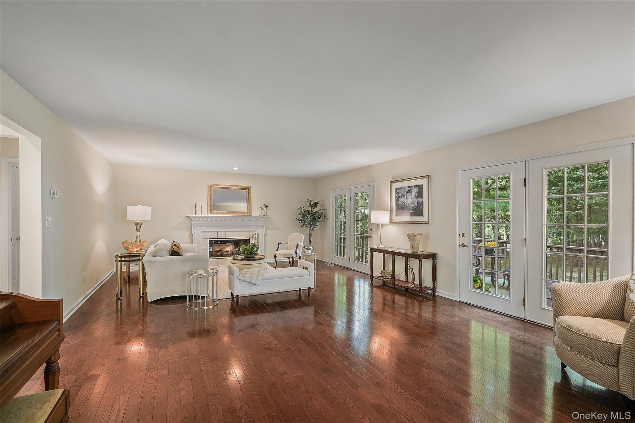 18 Cross River Road Mount Kisco, NY 10549 - Photo 6 of 30 a living room with fireplace furniture and a wooden floor