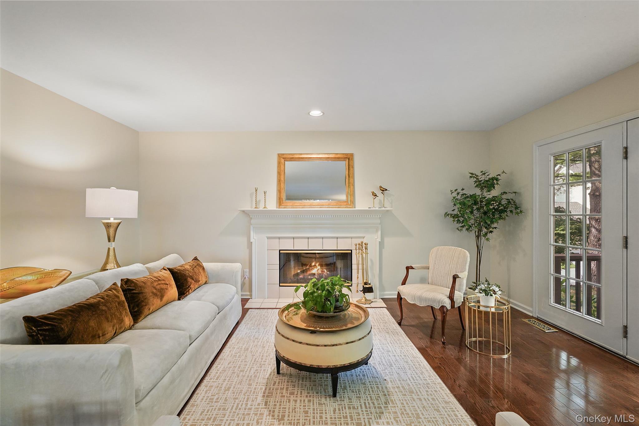 18 Cross River Road Mount Kisco, NY 10549 - Photo 7 of 30 a living room with furniture a window and a fireplace