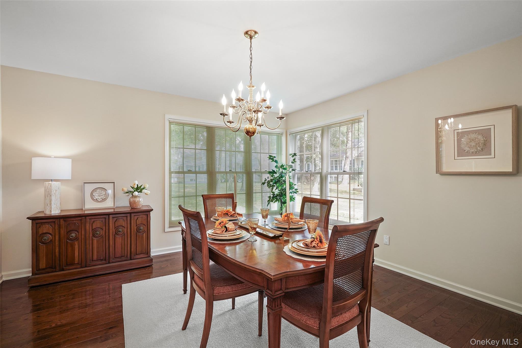 18 Cross River Road Mount Kisco, NY 10549 - Photo 10 of 30 a view of a dining room with furniture wooden floor and chandelier