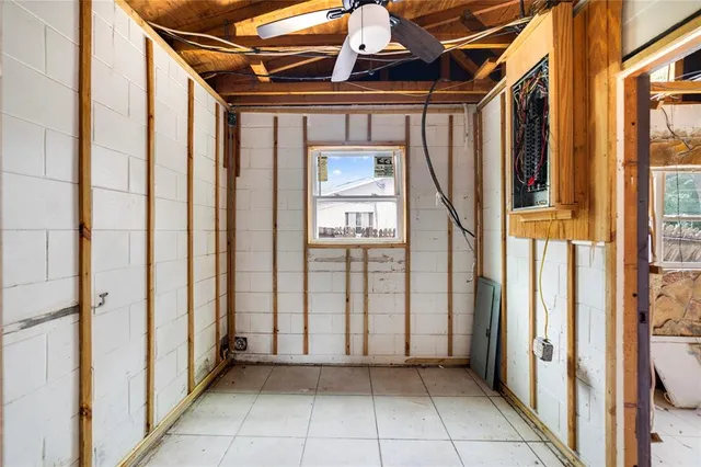 a view of a room with wooden walls