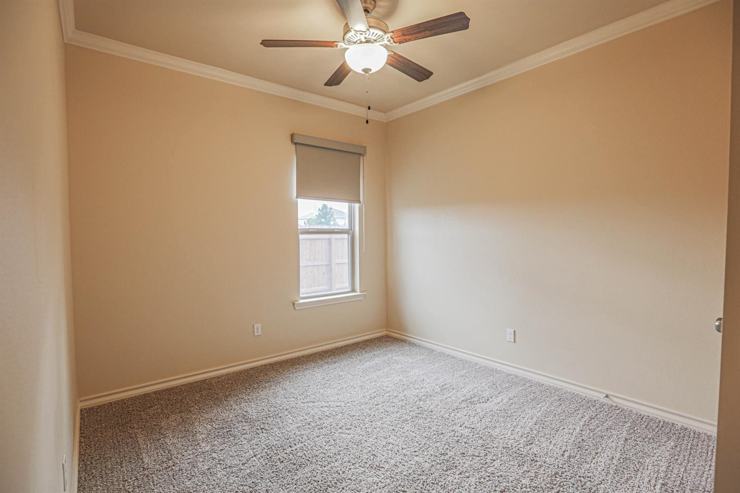 5019 Jarvis Street Lubbock, TX 79416 - Photo 19 of 31 an empty room with windows and fan