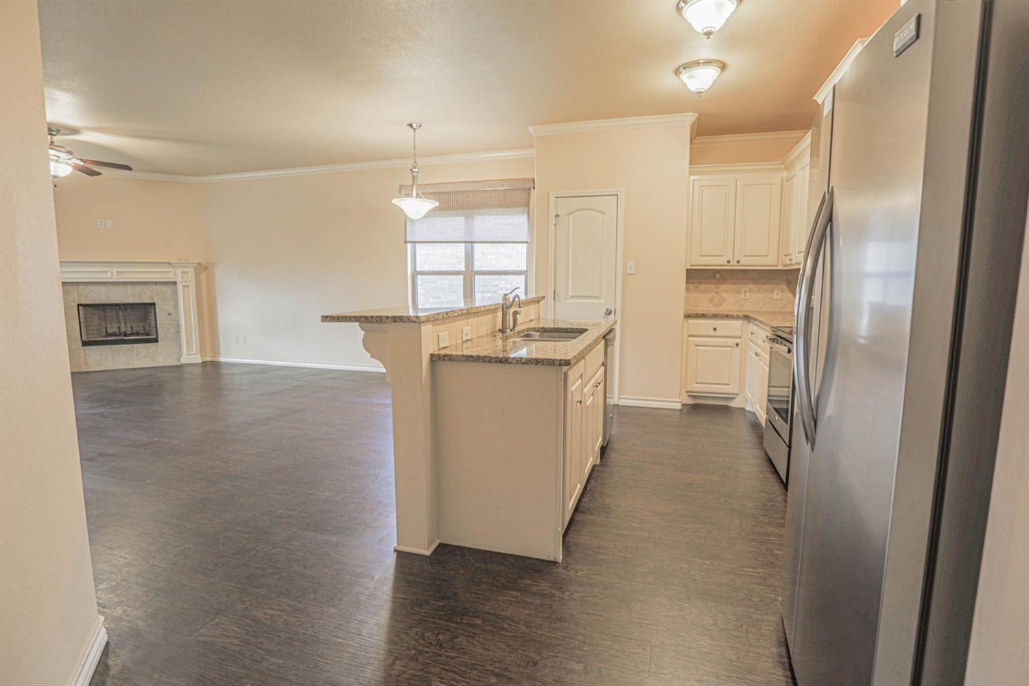 5019 Jarvis Street Lubbock, TX 79416 - Photo 4 of 31 a kitchen with stainless steel appliances a refrigerator and a stove