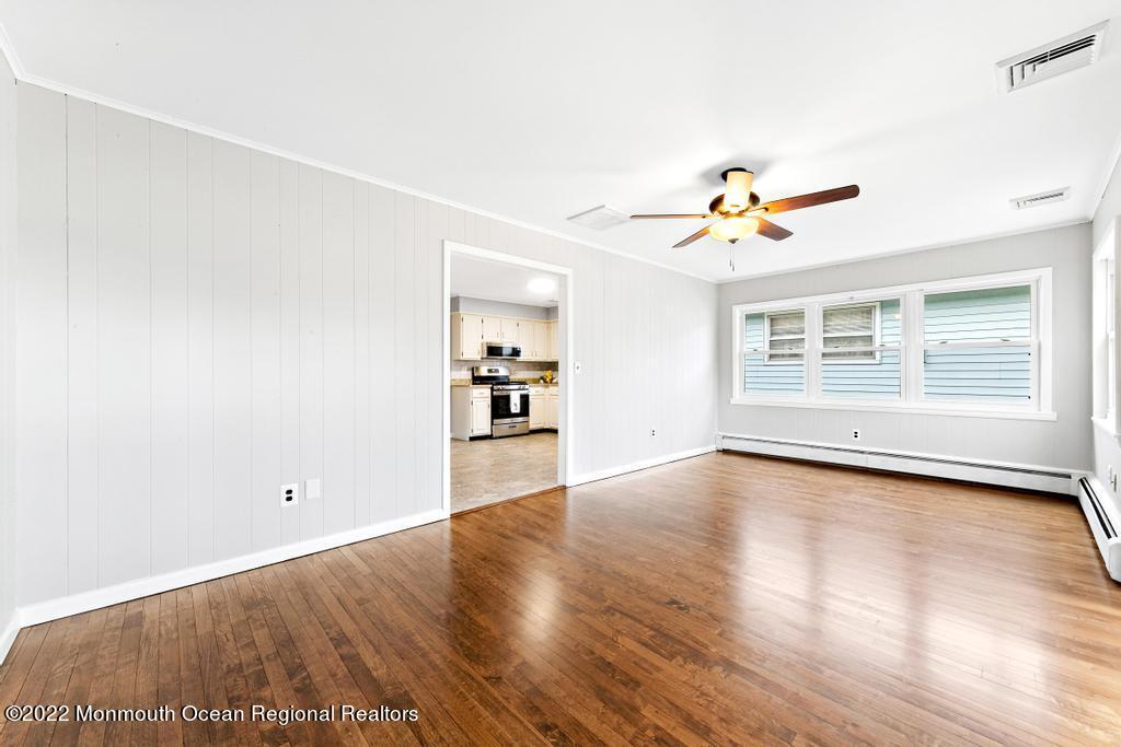 3 George Road Toms River, NJ 08753 - Photo 11 of 24 wooden floor in an empty room with a window