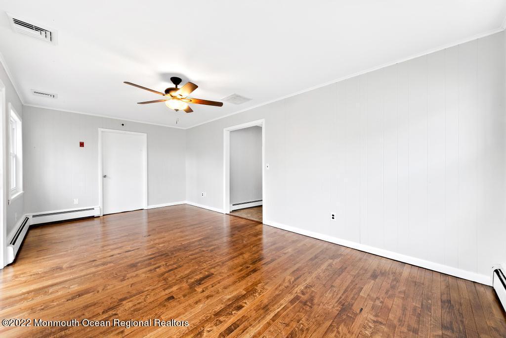3 George Road Toms River, NJ 08753 - Photo 12 of 24 wooden floor in an empty room with a window