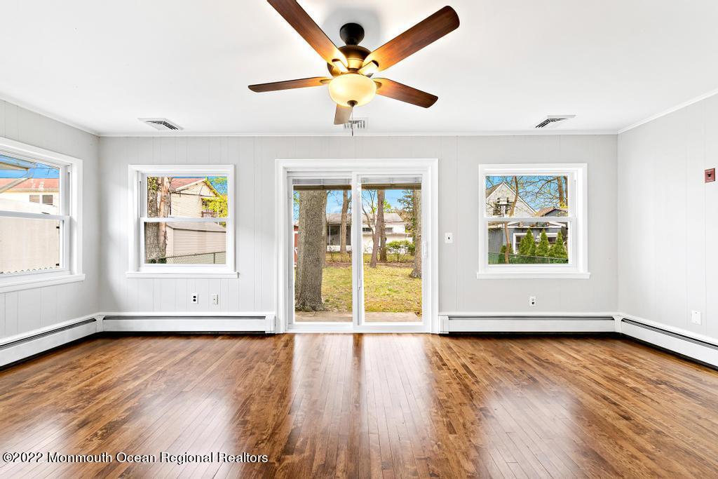 3 George Road Toms River, NJ 08753 - Photo 13 of 24 a view of an empty room with window and wooden floor