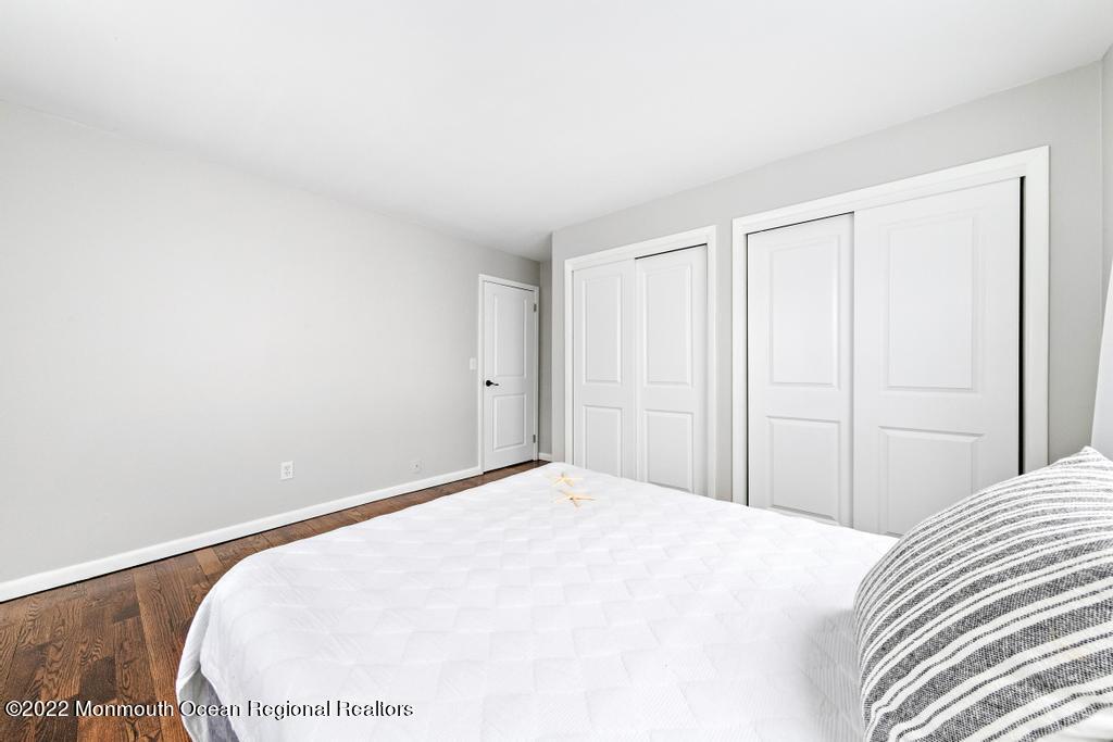 3 George Road Toms River, NJ 08753 - Photo 16 of 24 a bedroom with a bed and a wooden floor