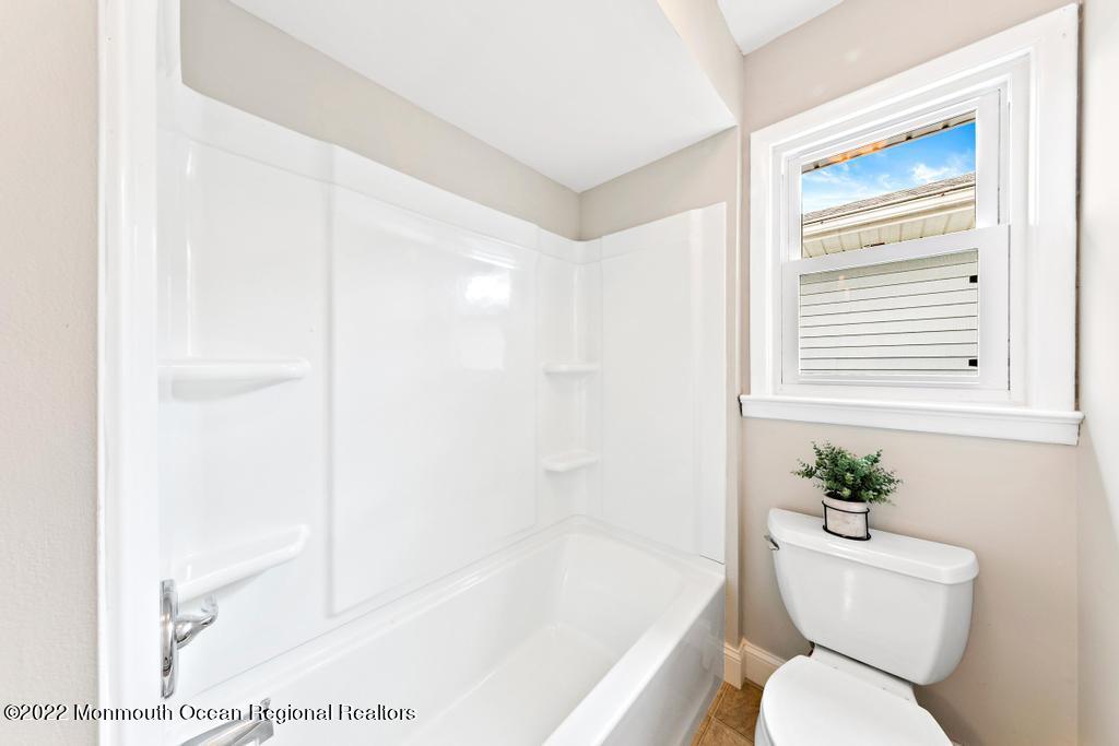 3 George Road Toms River, NJ 08753 - Photo 19 of 24 a bathroom with a toilet and a bathtub