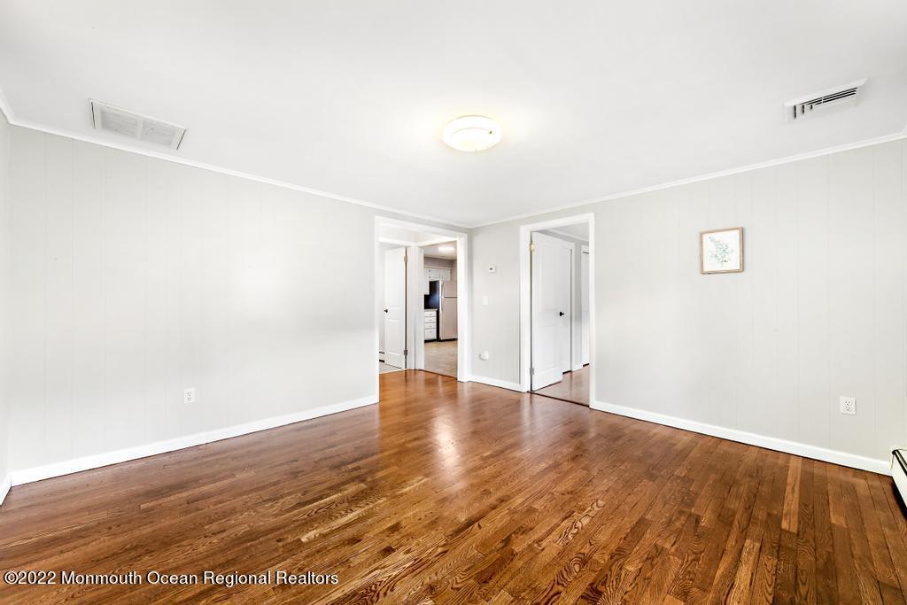 3 George Road Toms River, NJ 08753 - Photo 6 of 24 a view of an empty room with wooden floor