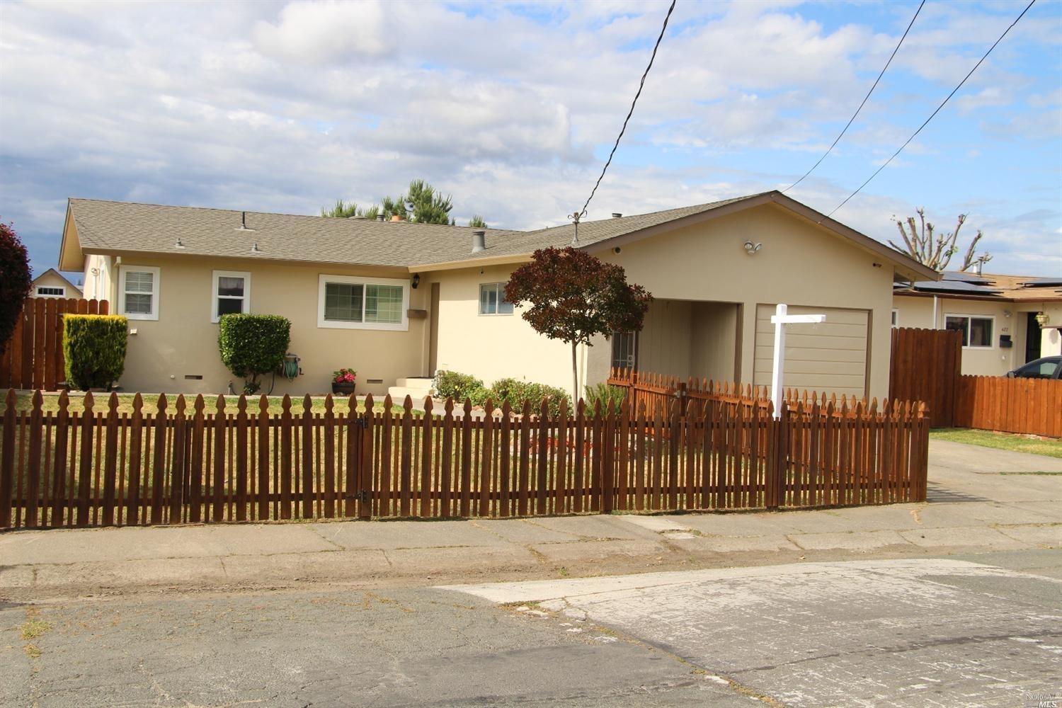 419 Flower Avenue Santa Rosa, CA 95404 - Photo 1 of 1 Picket fencing with gate surrounds front yard.