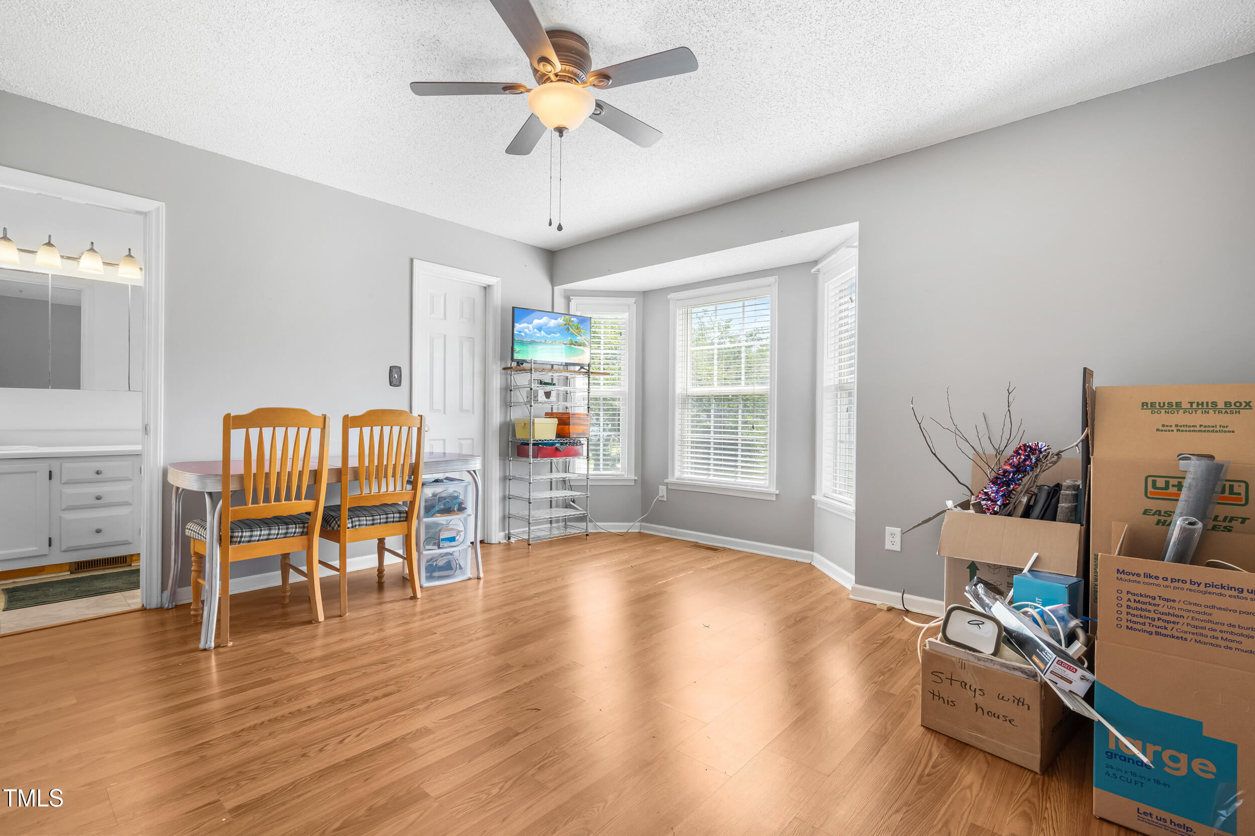 3831 Abattoir Road Angier, NC 27501 - Photo 10 of 28 a living room with furniture and a wooden floor