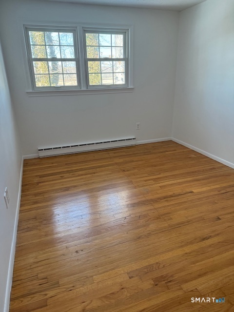 280 East Main Street, Unit E2 Clinton, CT 06413 - Photo 15 of 20 The second bedroom has hardwood floors and two windows that allow natural light.