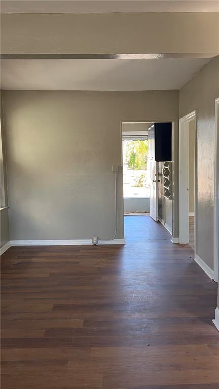 1101 South Ridgewood Avenue Daytona Beach, FL 32114 - Photo 19 of 37 a view of empty room with wooden floor and fan