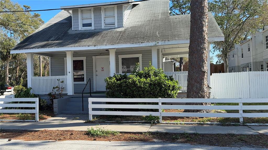 1101 South Ridgewood Avenue Daytona Beach, FL 32114 - Photo 24 of 37 a front view of a house with garden