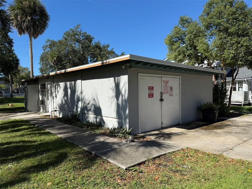 1101 South Ridgewood Avenue Daytona Beach, FL 32114 - Photo 32 of 37 a front view of a house with garden