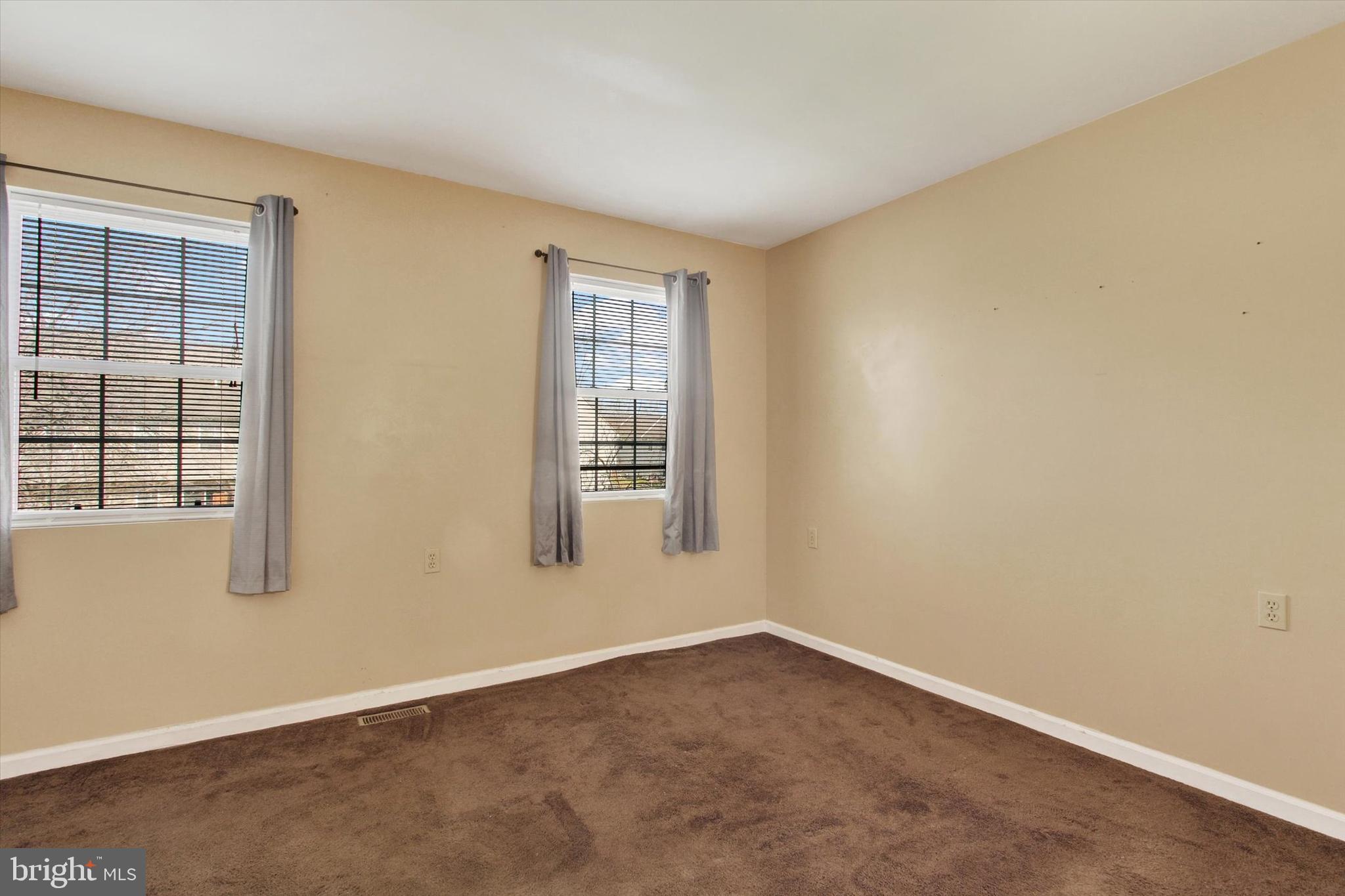 117 Orchard Lane, Unit 12 Hanover, PA 17331 - Photo 11 of 23 an empty room with windows