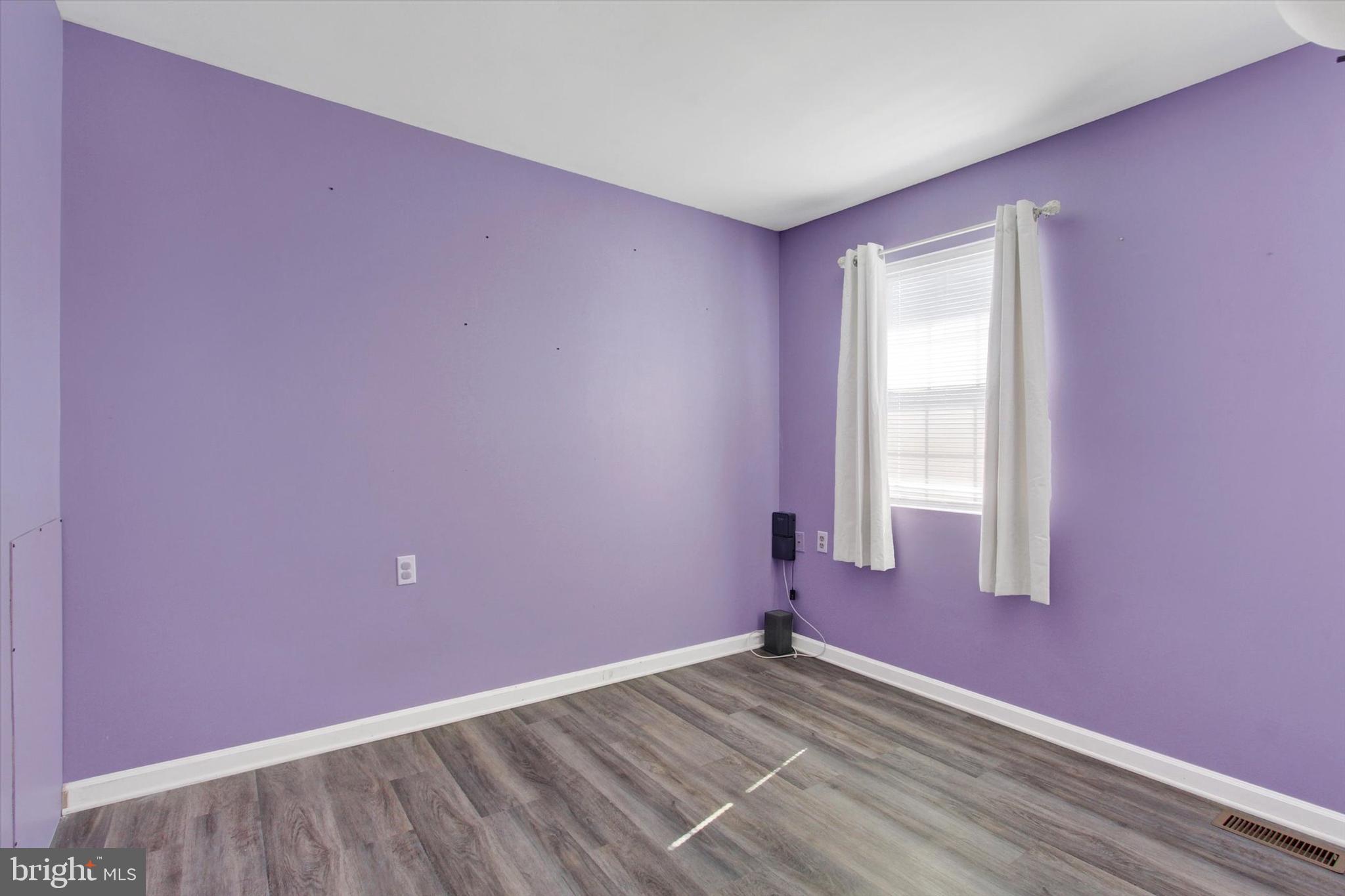 117 Orchard Lane, Unit 12 Hanover, PA 17331 - Photo 13 of 23 an empty room with wooden floor and windows