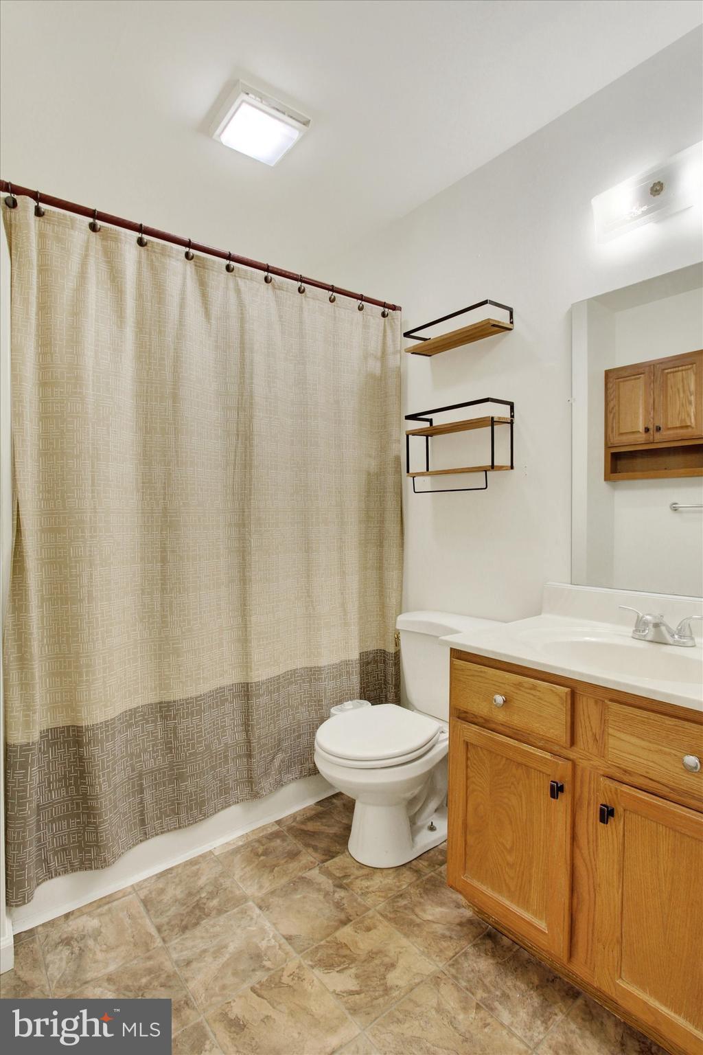 117 Orchard Lane, Unit 12 Hanover, PA 17331 - Photo 14 of 23 a bathroom with a toilet sink and a shower