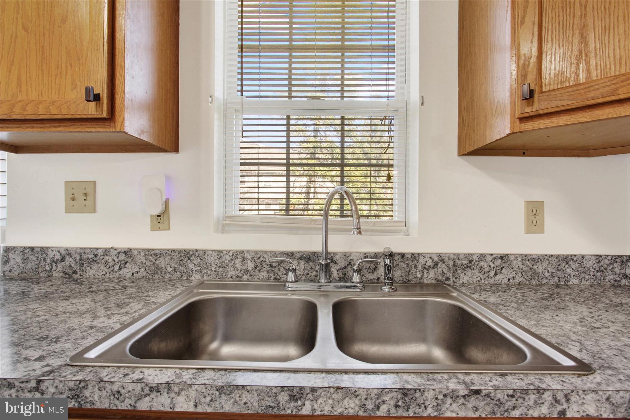 117 Orchard Lane, Unit 12 Hanover, PA 17331 - Photo 9 of 23 a kitchen with a sink and cabinets