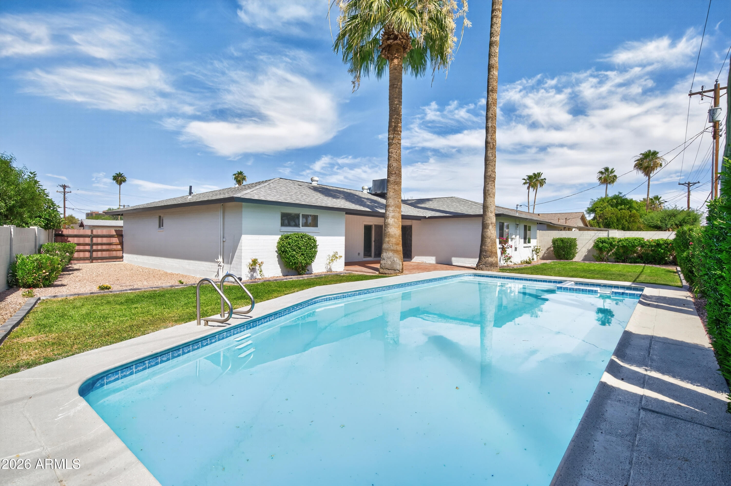 3422 South Terrace Road Tempe, AZ 85282 - Photo 31 of 43 a view of swimming pool with a garden and plants