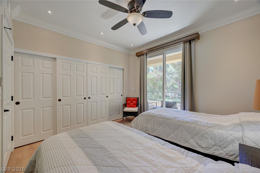 230 East Flamingo Road, Unit 106 Las Vegas, NV 89169 - Photo 18 of 66 Well-lit sleeping quarters with a private balcony and ample storage.