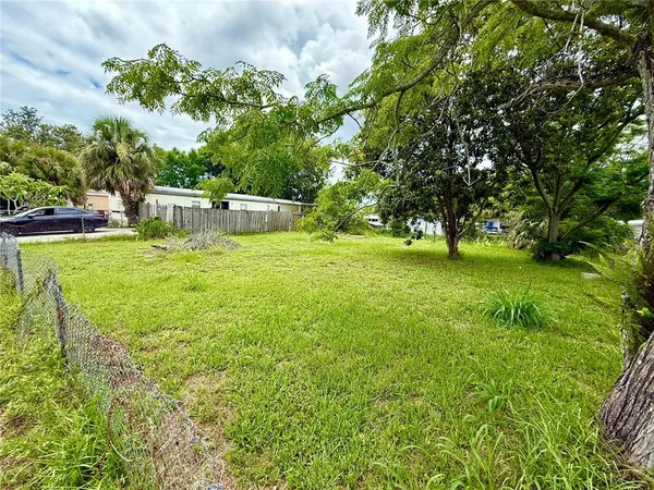 a view of a house with a big yard