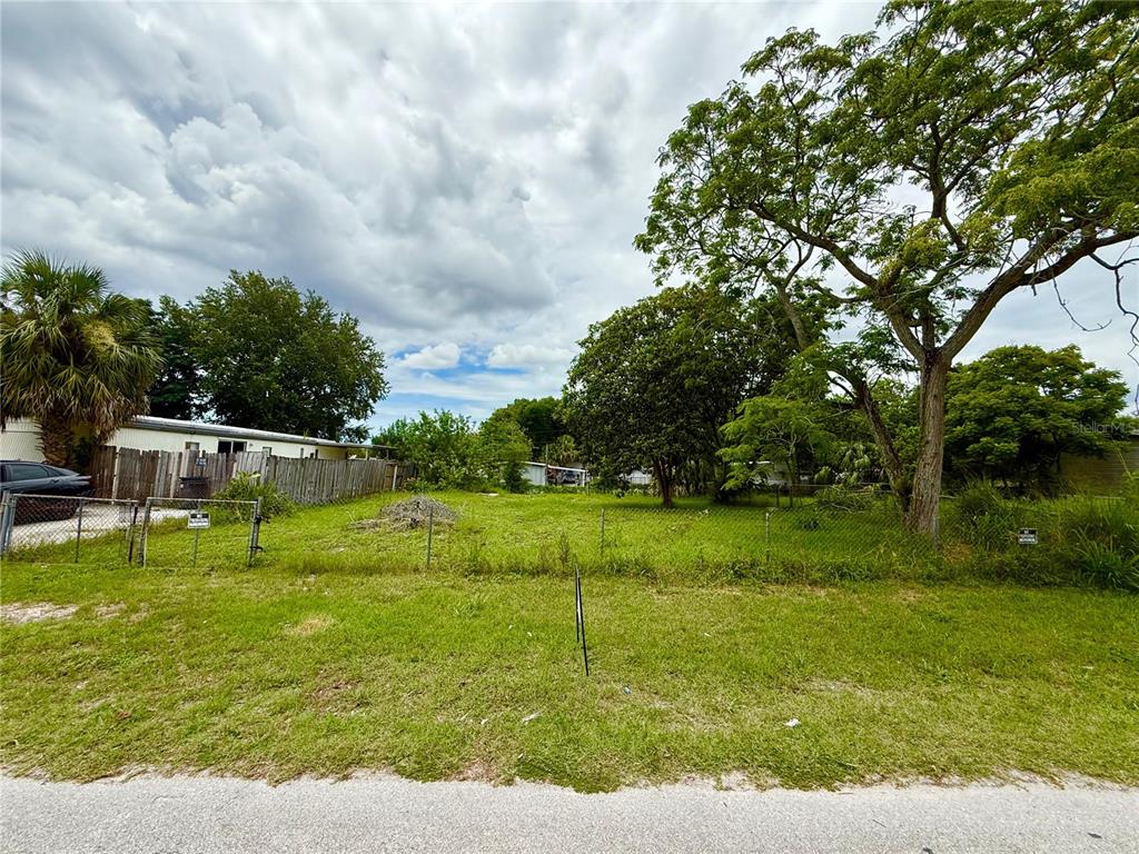 6539 Candice Lane New Port Richey, FL 34653 - Photo 2 of 3 a swimming pool with outdoor seating and yard