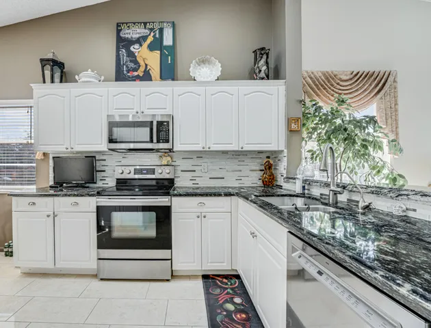 a living room with furniture a refrigerator and a table