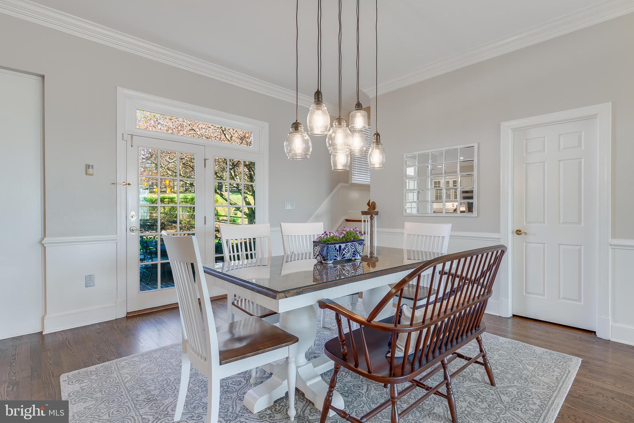 15140 Loyalty Road Waterford, VA 20197 - Photo 18 of 60 a dining room with furniture a rug a potted plant and a chandelier